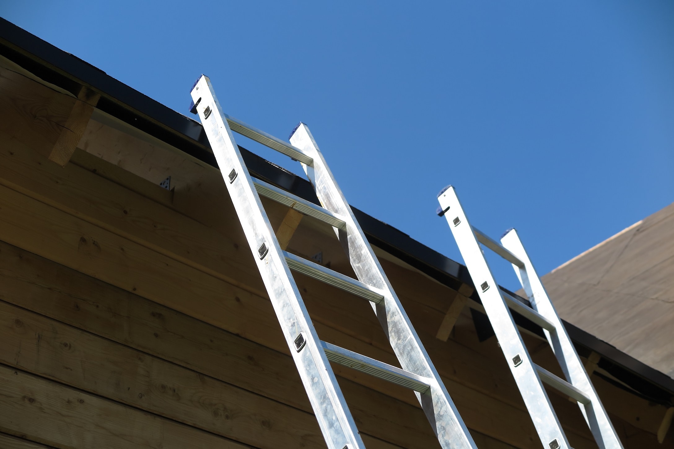 Safety Tips For Roofers 6 ladder leaning against roof