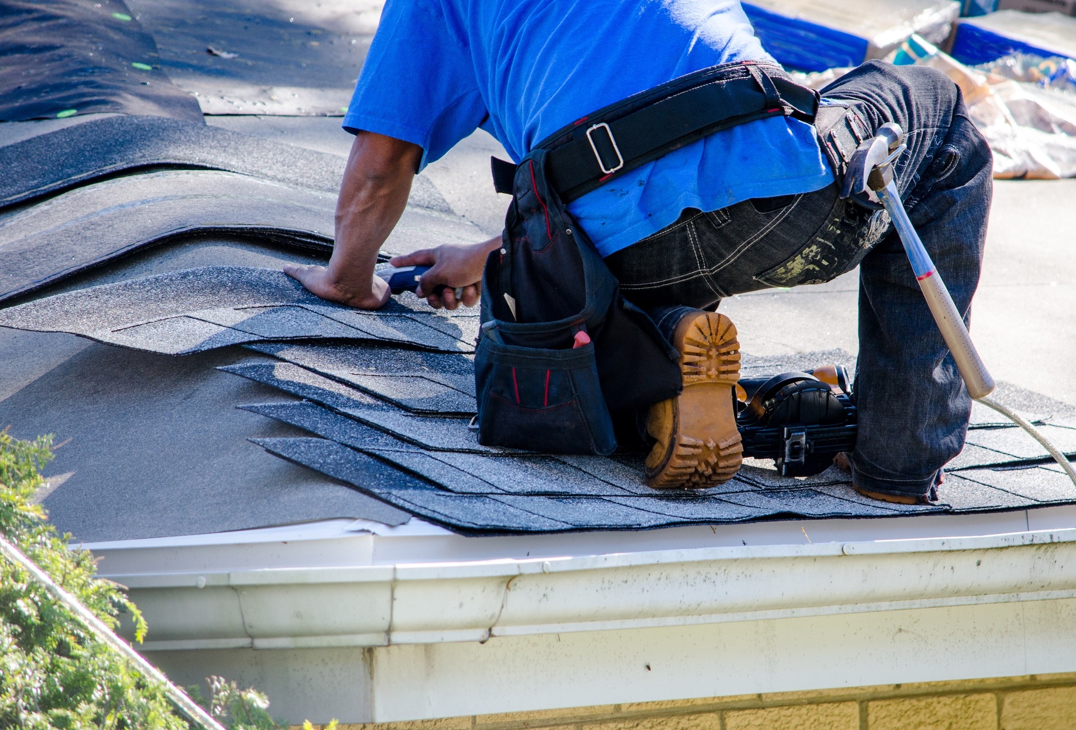 Safety Tips For Roofers 3 roofer cutting tiles with work boots on