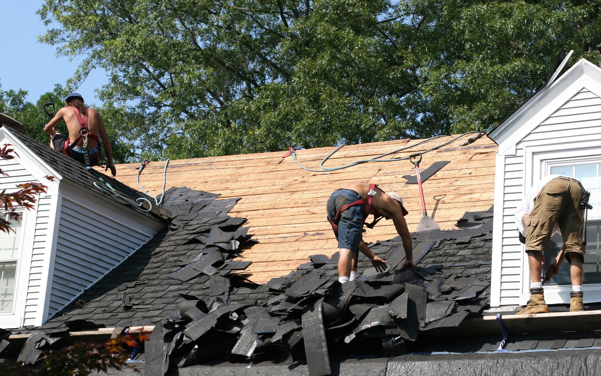 Safety Tips For Roofers 2 three men on a roof roofing