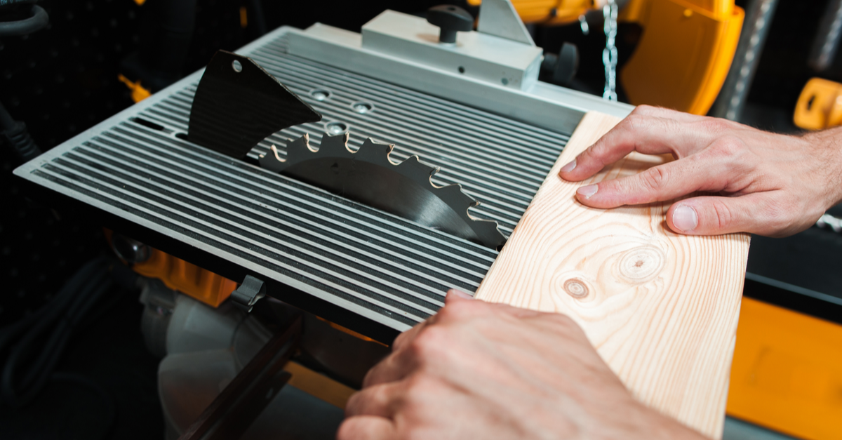 5 Signs Your Company Needs an Ergonomics Evaluation 3 man pushing wood through a table saw