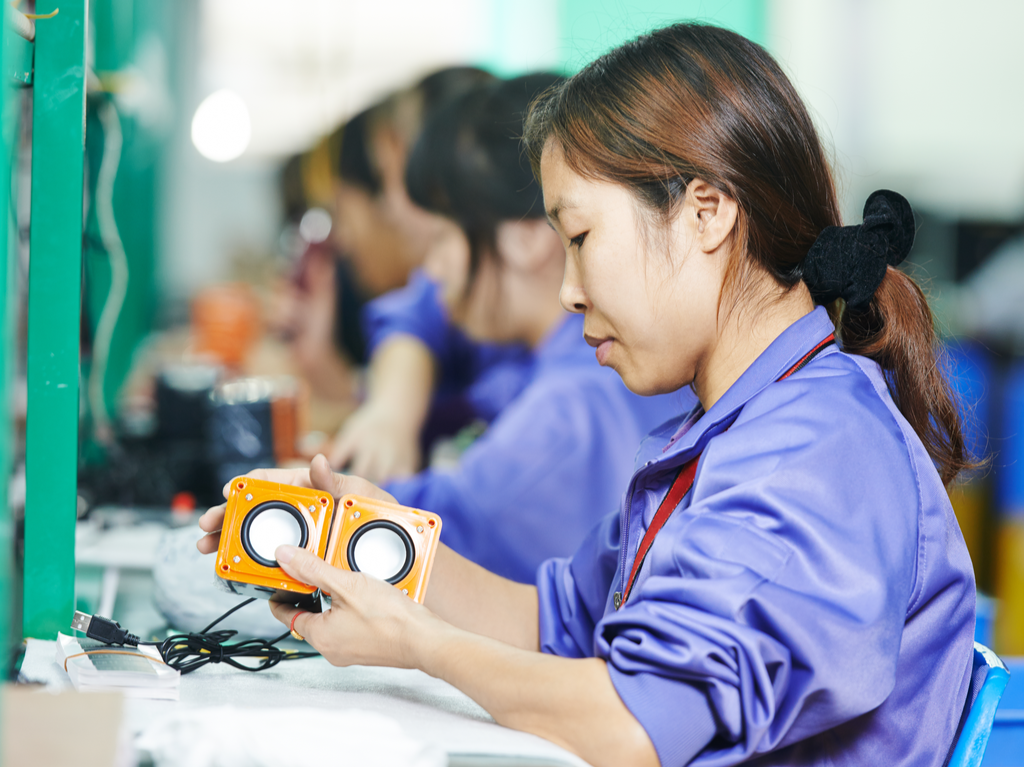 On Repeat: Workplace Solutions for Repetitive Motions 2 factory worker with small speakers