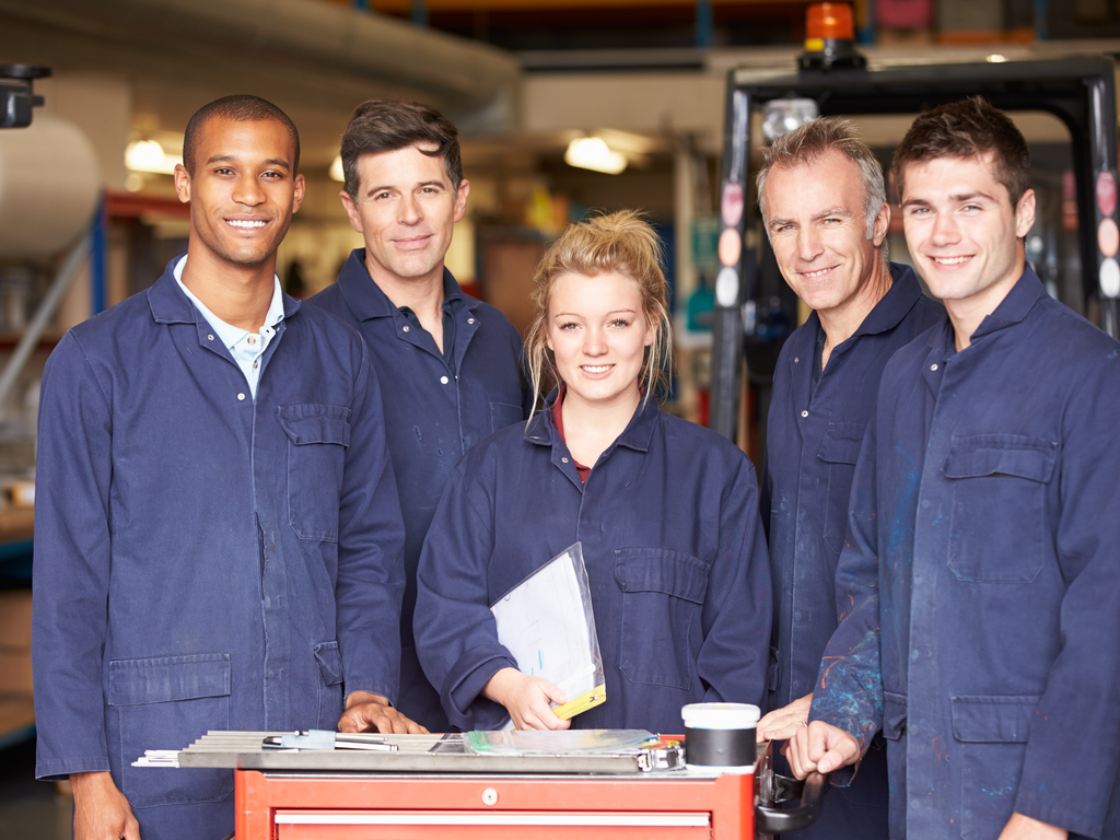 On Repeat: Workplace Solutions for Repetitive Motions 5 5 young warehouse workers in blue jumpsuit
