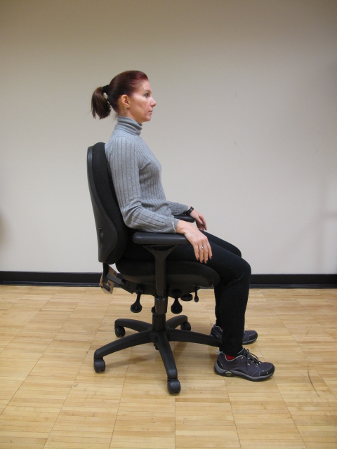 How to Sit Properly At Your Desk 3 girl sitting in chair with good posture