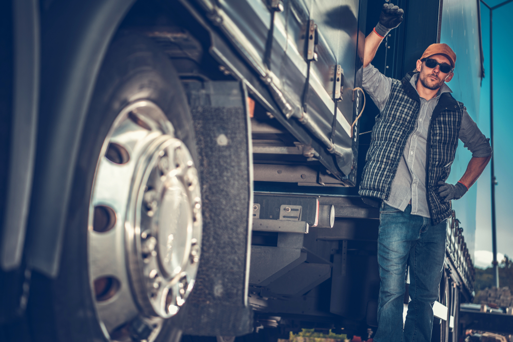 How COVID-19 Is Changing the Trucking Industry 2 guy leaning up against his truck